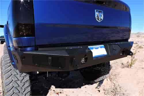 10-Up Dodge Ram 2500/3500 HoneyBadger Rear Bumper with lockable storage box in Hammer Black with Satin Black panels.