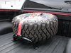 Universal Bed Mounted Tire Carrier With Red Strap - image 3