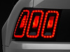 100807 Icon LED Tail Lights for 2099-2004 Ford Mustang (Excl. 99-01 Cobra), Black Housing [Smoked Lens] - image 1