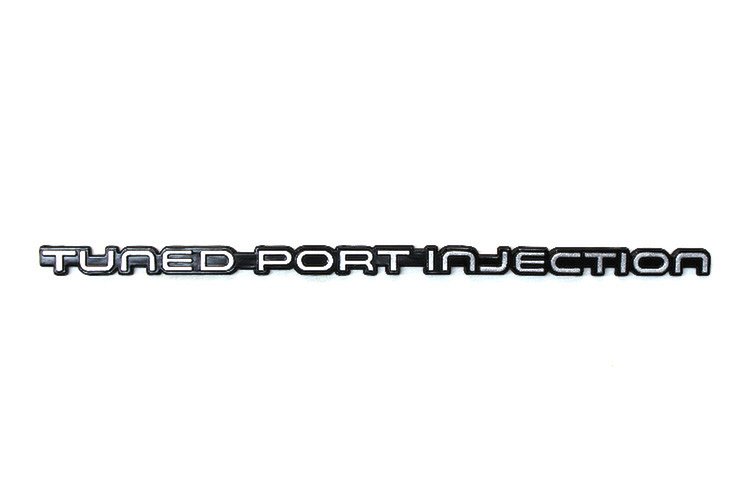 14083453 Tuned Port Injection Rear Bumper Emblem, 1982-1992 Chevy Camaro, Silver